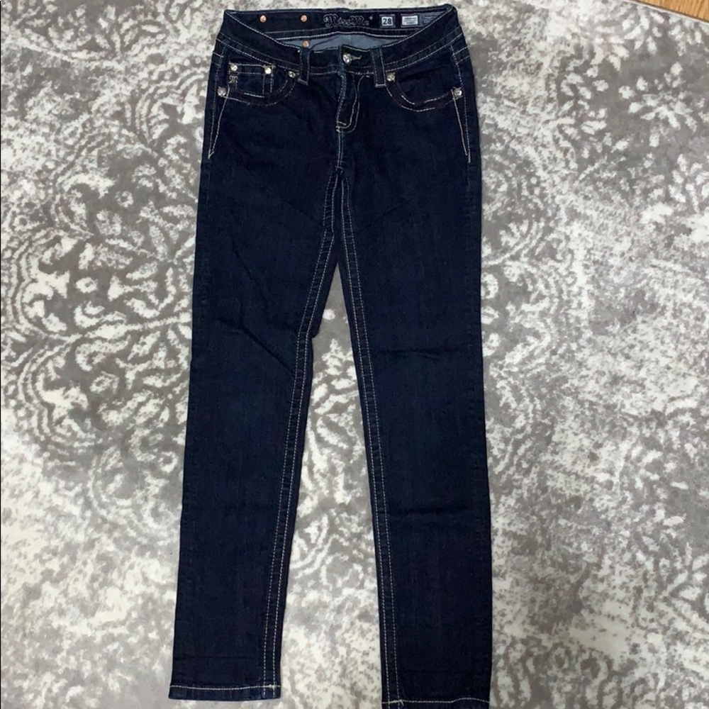 Dark wash Miss Me Skinny jeans.